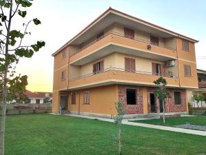 a large building with a lawn in front of it at Villa Sota Divjakë in Divjakë