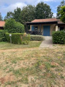 a house with a table and chairs in the yard at Gîte de la Bastide de Domme in Domme +18 photos