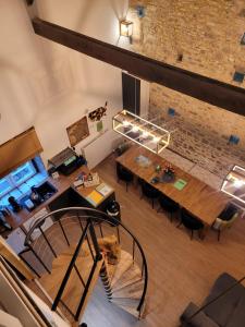 an overhead view of a loft with a table and a staircase at Holidays-Normandy - Ursula gîte 