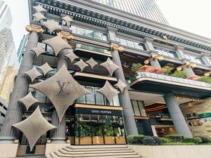 a building with star decorations in front of it at Renaissance Bangkok Ratchaprasong Hotel in Bangkok