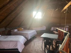 Una cama o camas en una habitación de Kareepan Lapa