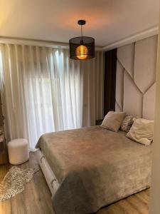 Ένα ή περισσότερα κρεβάτια σε δωμάτιο στο Rent apartment in a secure residence