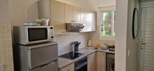 Kuchyň nebo kuchyňský kout v ubytování House C13 Ilios 2 Complex