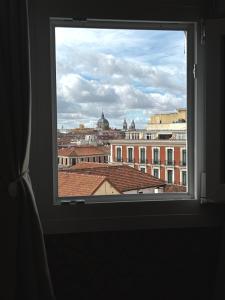 a view of a city from a window at Apartamento Preciados in Madrid