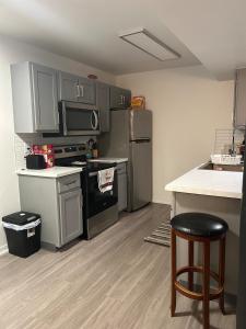a kitchen with stainless steel appliances and a counter at Very spacious 1Bed 1Bath Unit in Saint-Louis