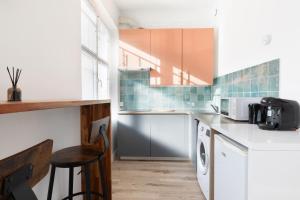 Kuchyň nebo kuchyňský kout v ubytování Magnifique studio Neuf 4personnes - 15min Paris + 9 fotografií