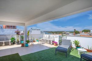 a balcony with a view of the city at Alvor Ar de Mar Apart in Alvor