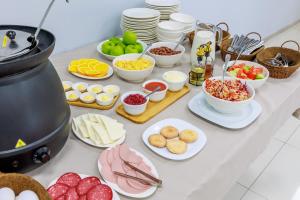 a table with many different types of food on it at Route Hotel in Tbilisi City +46 photos