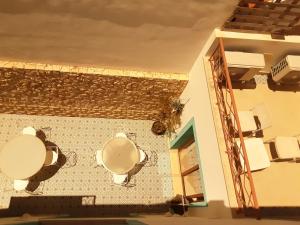 a room with toilets on the wall of a building at Alvor Ar de Mar Apart in Alvor +34 photos