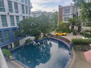 a swimming pool in the middle of a city at Arisara Nest in Bophut 