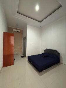 Postel nebo postele na pokoji v ubytování Pondok Agung Rubicon