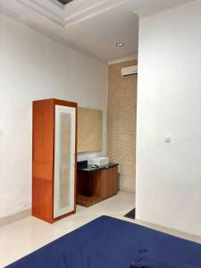 Postel nebo postele na pokoji v ubytování Pondok Agung Rubicon