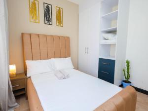 Postel nebo postele na pokoji v ubytování Desert Daisy