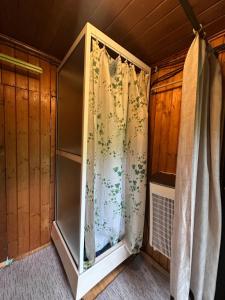a room with a shower curtain in a house at Srub pod Lysou horou in Ostravice +7 photos