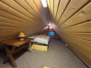 a room with a bed and a table in a igloo at Srub pod Lysou horou in Ostravice