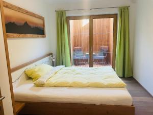 Postel nebo postele na pokoji v ubytování Bergappartement Talblick