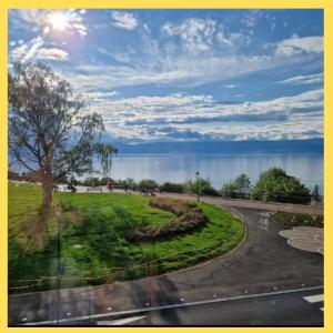 a view of the water from a train window at Le Bellevue 2 in Thonon-les-Bains +28 photos