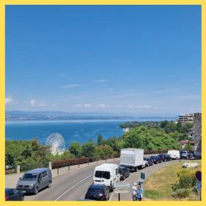a highway with cars and trucks parked on the road at Le Bellevue 2 in Thonon-les-Bains