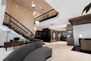 an open living room with a couch and stairs at Crowne Plaza Panama by IHG in Panama City