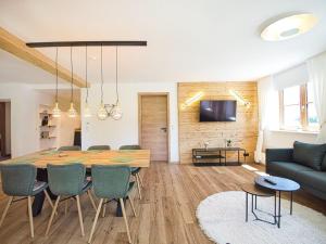 a living room with a table and a couch at Ferienwohnung Hochkalterblick in Schönau am Königssee