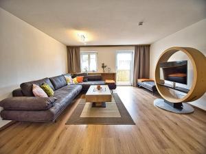 a living room with a couch and a table at Am Bruckenstüberl in Schönau am Königssee