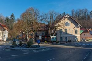 an empty street in a town with a house at Gostišče Pod Kostanji in Dobrna
