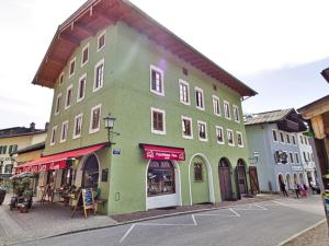 a green building on the side of a street at Ferienwohnung Faes in Berchtesgaden