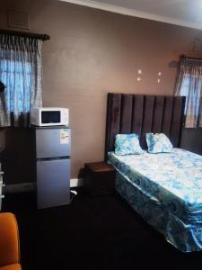 Ένα ή περισσότερα κρεβάτια σε δωμάτιο στο Yellow Stars Guesthouses