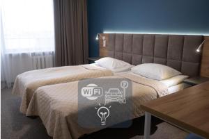 Ένα ή περισσότερα κρεβάτια σε δωμάτιο στο Hotel Halychyna