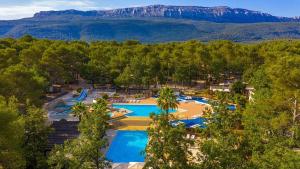 an aerial view of a resort with two pools at Le Coin Provençal in Nans-les-Pins