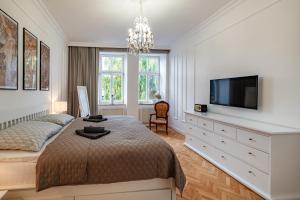 Postel nebo postele na pokoji v ubytování Symphony Apartment