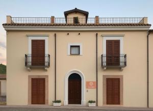 a building with two balconies on top of it at La Trita Dimore di Charme in Bussi sul Tirino