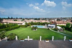 an aerial view of a house with a green yard at Villa Angela - Italian Homing in Desenzano del Garda