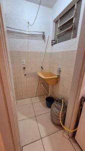 a bathroom with a sink and a tiled floor at Apartment in Rio Grande Great location in Rio Grande +3 photos