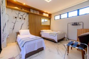 Postel nebo postele na pokoji v ubytování Casa na praia Brava com piscina e jardim WM9244 + 15 fotografií