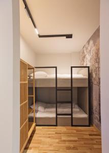 a room with two bunk beds in it at Apartament Ułański - City Park in Poznań