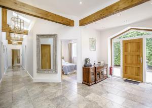 a large room with a door and a mirror at Ladera Retreat Lodges in Eaton +59 photos