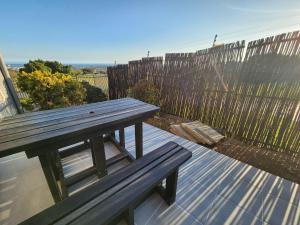 a wooden bench sitting on top of a roof at 8 Vineyard in Somerset West