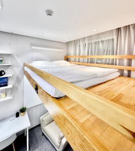 a bedroom with a wooden bunk bed at The All-in-One Loft in Ulaanbaatar