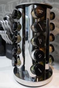 a wine rack filled with lots of wine bottles at - 5-Min Walk To Metro - Free Prking - Escape in Alexandria