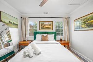 a bedroom with a large bed and two windows at - 5-Min Walk To Metro - Free Prking - Escape in Alexandria