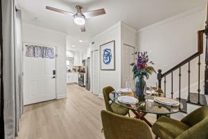 a dining room with a glass table and chairs at - 5-Min Walk To Metro - Free Prking - Escape in Alexandria
