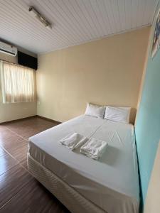 Postel nebo postele na pokoji v ubytování Pousada cores