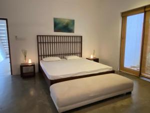 Ένα ή περισσότερα κρεβάτια σε δωμάτιο στο Kohomba House Colombo