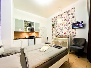 Η κουζίνα ή μικρή κουζίνα στο Cozy Central Studio AC- Purple Room