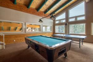 a pool room with two ping pong tables in it at Buffalo Ridge C302 in Silverthorne
