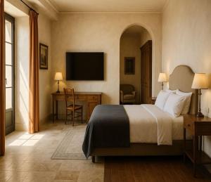 a hotel room with a bed and a desk and a television at Sidena Bovest in Rasa