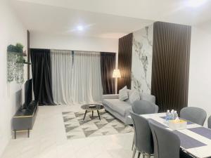 a living room with a couch and a table at Eaton Delight Residences in Kuala Lumpur +197 photos