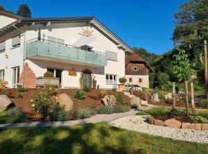 a house with a garden in front of it at Ferienhof Giedensbach in Oberkirch