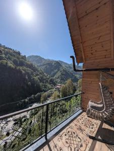 a balcony with a view of the mountains at Walnut Bungalow in Çamlıhemşin